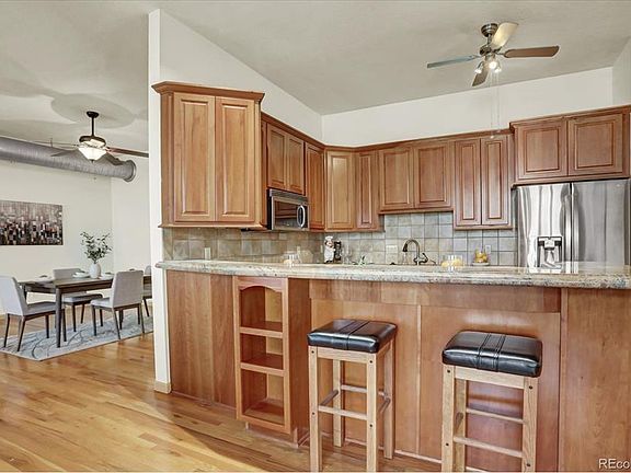 Recessed lighting plus ceiling fan/light, beautiful granite counters