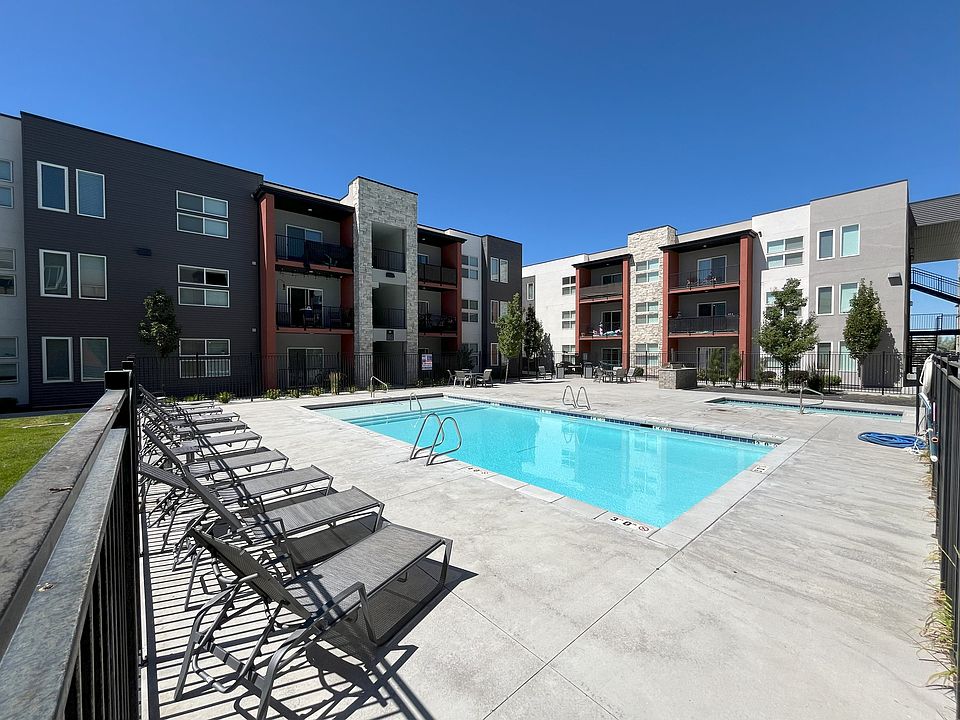 The community features a pool and large hot tub, with lots of lounging space. There is also a propane BBQ area and entertainment space next to the hot tub.