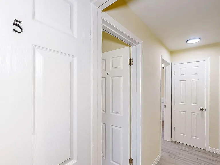 Looking down the hall. There are 3 bedrooms in this wing.