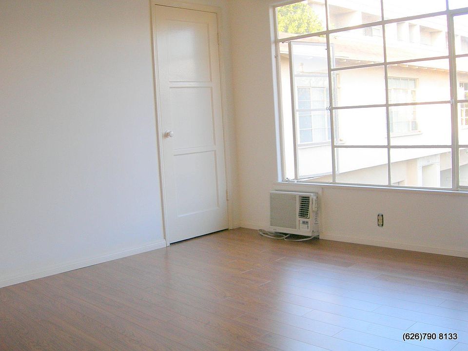 Living room w window AC and ceiling fan (not shown)