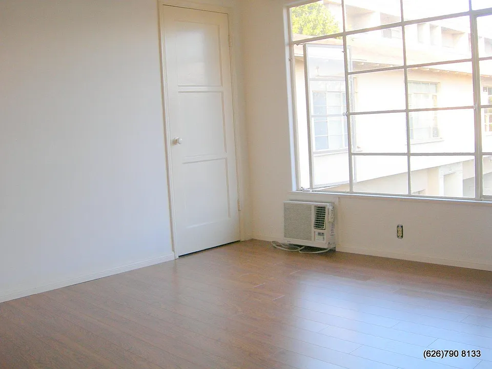 Living room w window AC and ceiling fan (not shown)