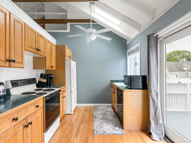 1st floor - Full Kitchen with Fridge, Stove, Dishwasher with sliding door to deck patio with fire-pit and Grill