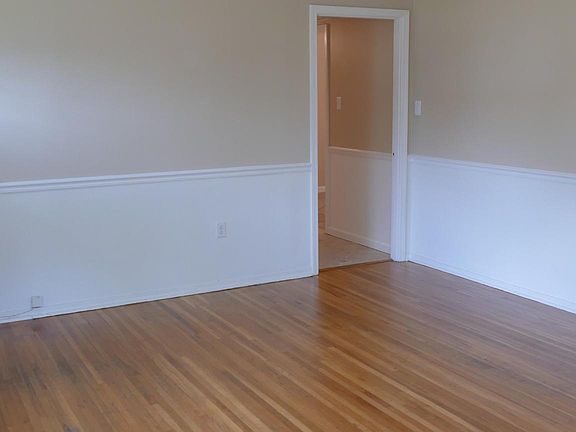 Living room view 2. Doorway shown leads into hallway.