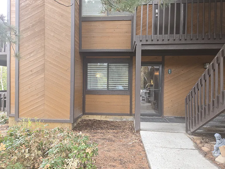 Easy, level walkway from the parking lot with 2 unassigned parking spaces. New insulated front door with keypad lock, insulated storm door with built-in sliding panel for a summer screen door feature