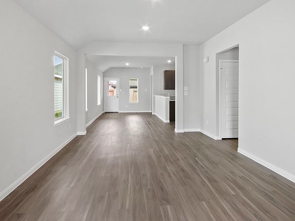 Family Room to Dining and Kitchen Area