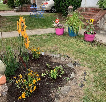 Flowers and Vegetable gardens -all access front and back yards.