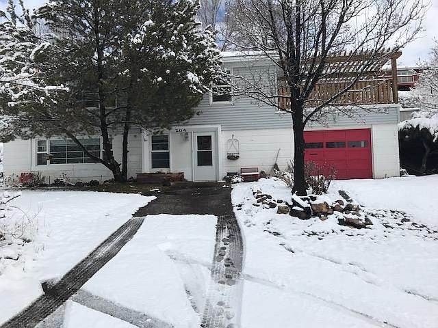 outside, renter uses driveway in front of door