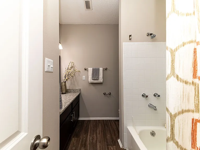 Bathroom with hardwood-style flooring