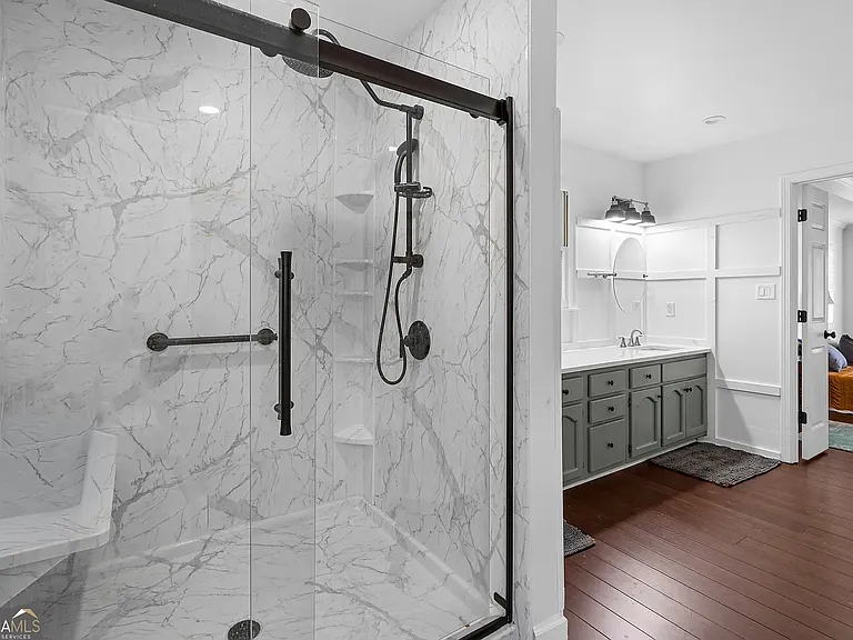 Master bathroom shower and two-sink vanity
