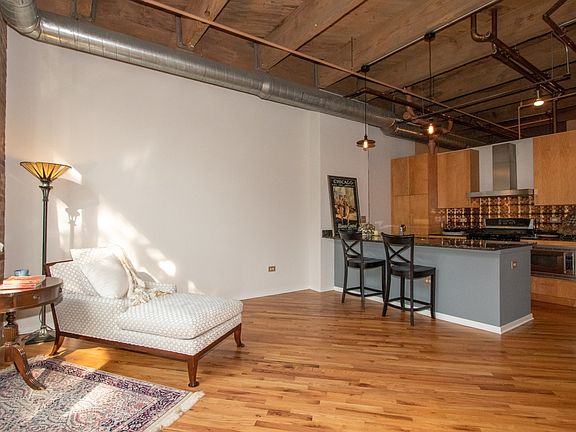 True timber loft home with soaring ceilings and exposed brick