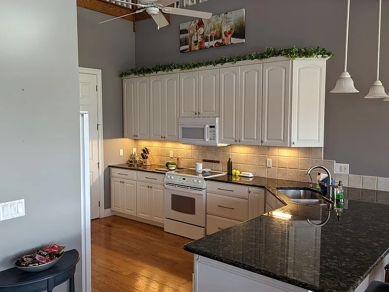 Kitchen view from dining nook. Note the balcony and loft overlooking the kitchen.
