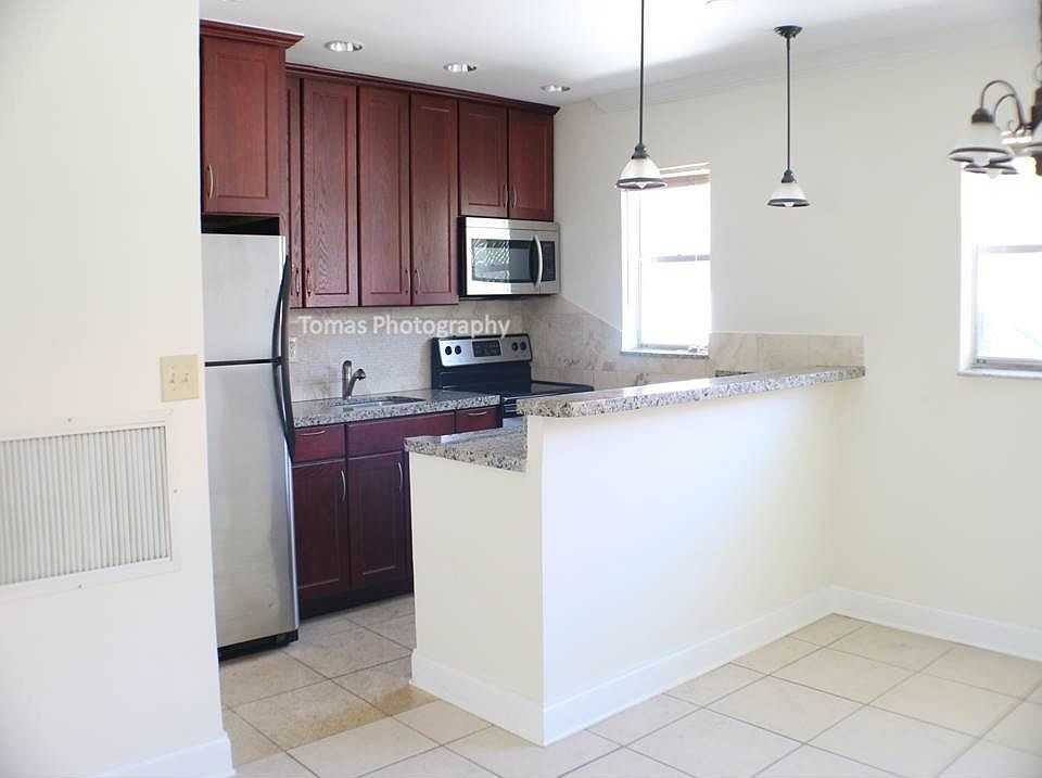 Huge open kitchen with breakfast bar