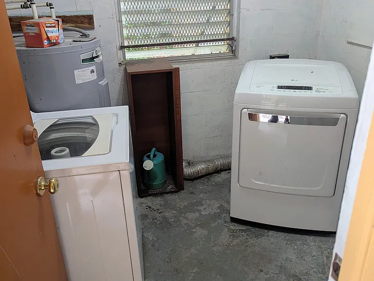 Laundry room with both washer and dryer