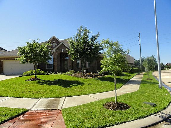  Spacious One Story with a 3 car Tandem Garage on a   large lot.