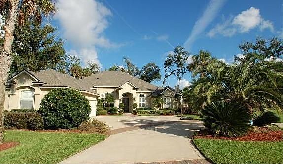 Home sits on large lot with circular driveway