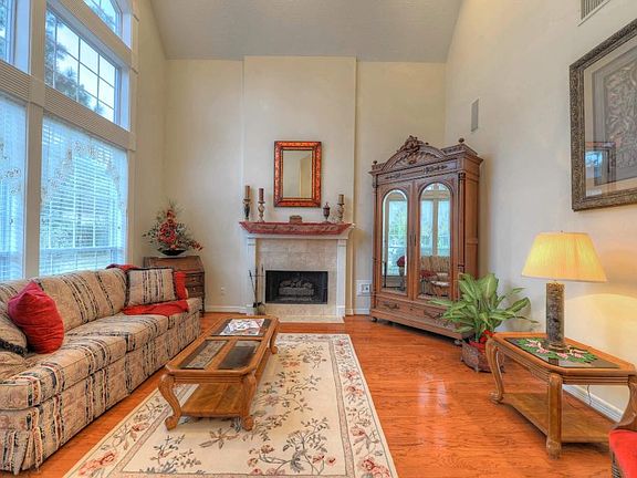 Just off the impressive foyer, the handsome formal living area offers a spacious area for entertaining with built-in surround sound. Large windows give excellent views of the manicured front lawn, a 2nd gas fireplace graces this lovely space.