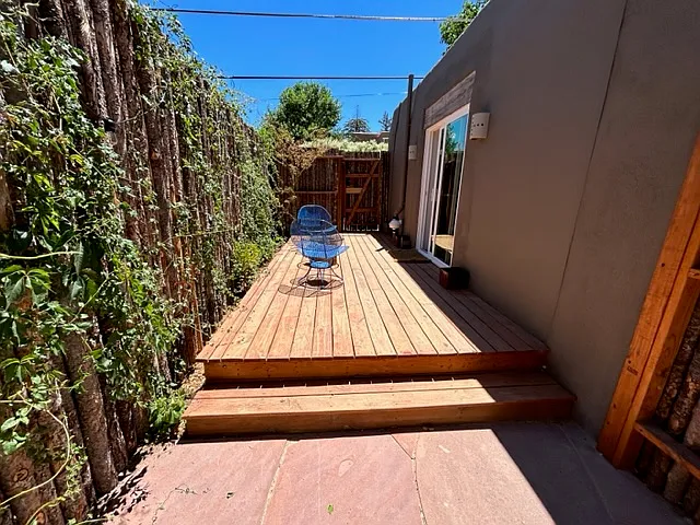 Casita fenced-in private deck and flagstone patio.