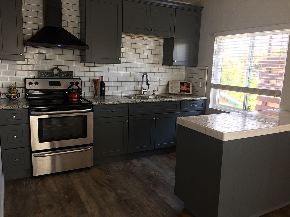 Fully remodeled w/Beautiful granite countertop, Stainless steel appliances , large island w plenty of cabinet space. Vinyl plank flooring throughout.