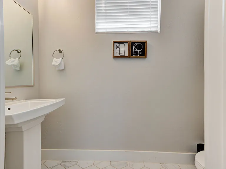 Half bathroom next to front door