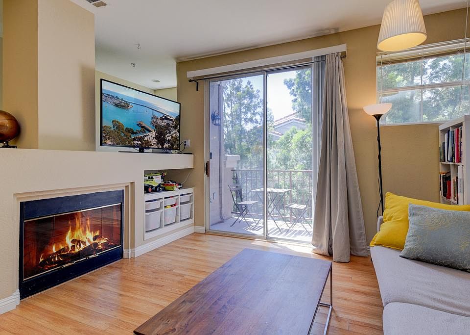 Bright and spacious living room with a beautiful fireplace.