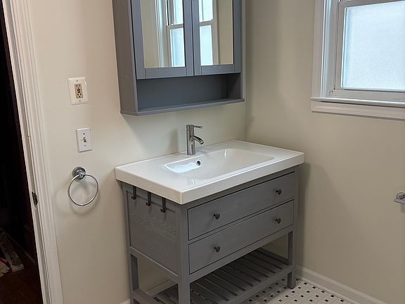 Bathroom vanity and medicine cabinet
Classic black and white tile floor