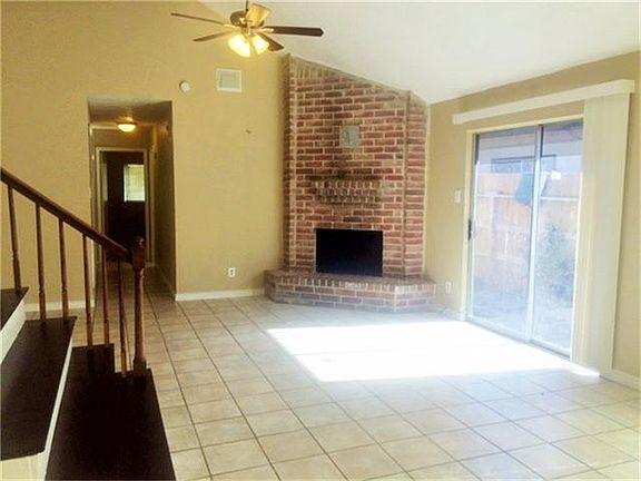 Living room area with hallway that leads to 3 bedrooms