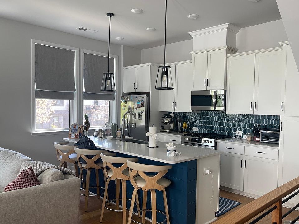 Kitchen with roomy island and stainless appliances