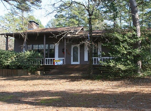 Centrally located on 6 lots in the rolling piney woods.