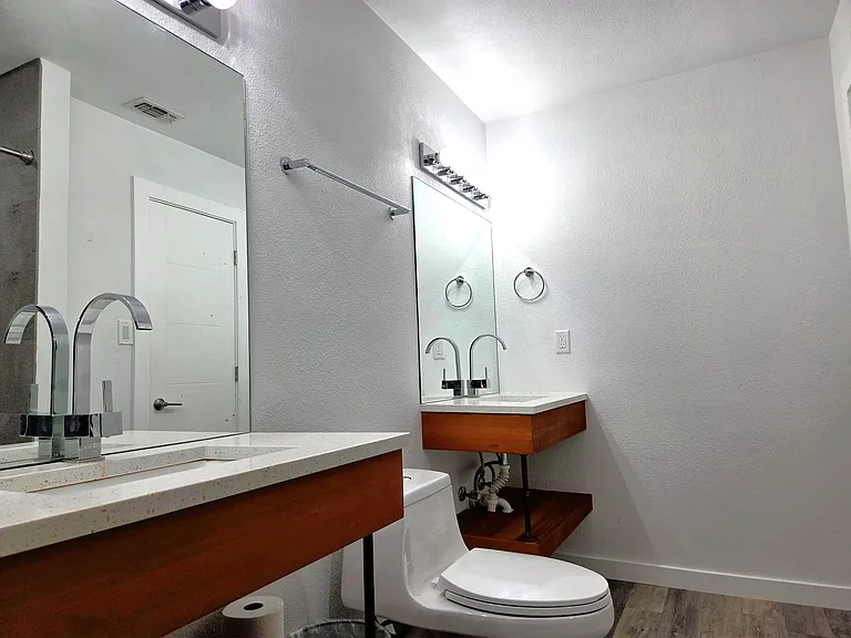 Upstairs Jack and Jill style bathroom with dual vanity and rain shower