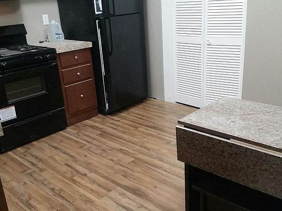 Kitchen, stove, refrigerator, dining table