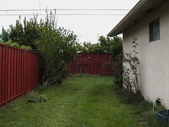 looking into backyard from garage (which has both front and rear door)