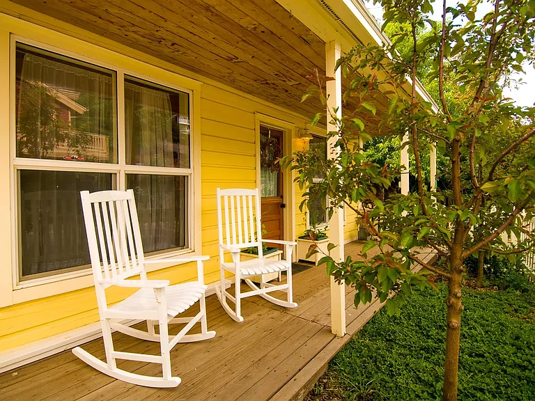 Front porch with rocking chairs.