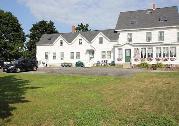 Grassy yard and parking lot