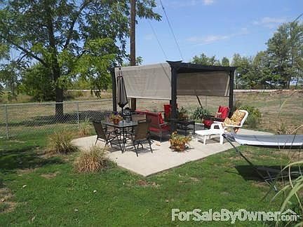 Backyard
						:
						Metal pergola with cover inside of fenced backyard. HUGE lot outside of fence.