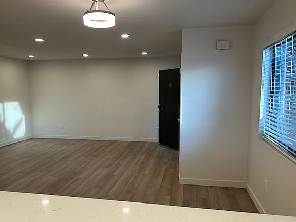 View from kitchen into dining area and living room