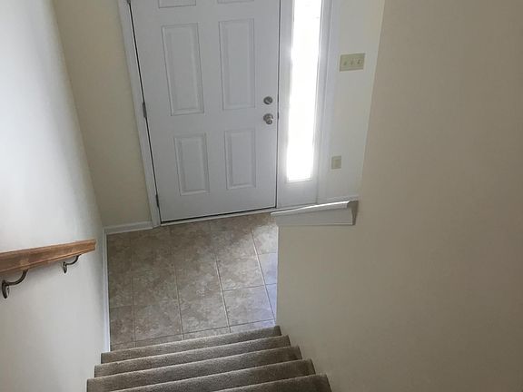 Front Door and Stairs to Main Floor