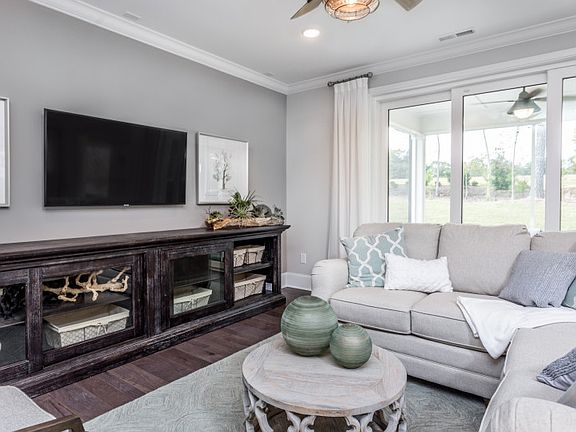 Beautiful gathering room with screen lanai