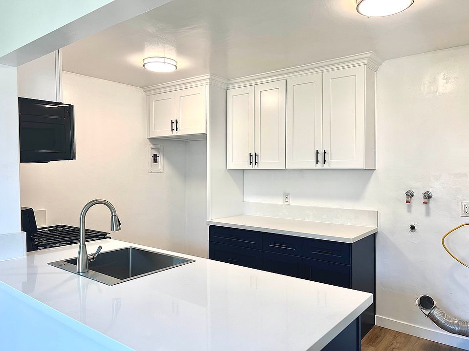 Space for refrigerator and stacked washer and dryer combos