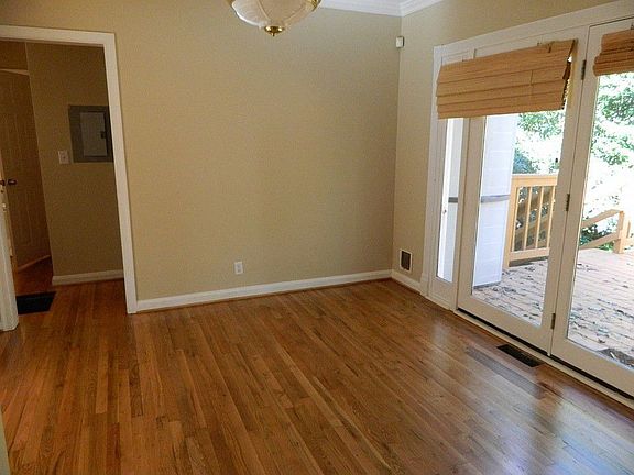 Dining room with French doors opening to an expansive deck