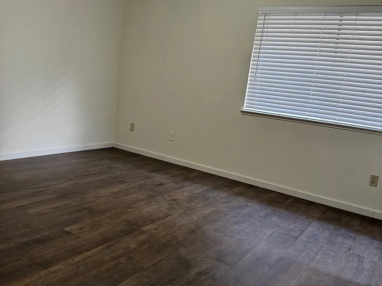 Spacious Master Bedroom with en suite bathroom, ceiling fan, 2 closets, big window and Pergo Flooring