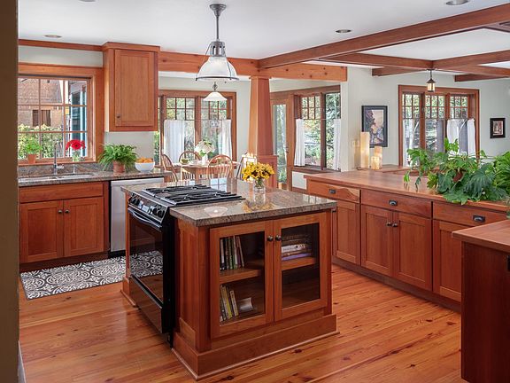Kitchen with cherry cabinetry and granite countertops