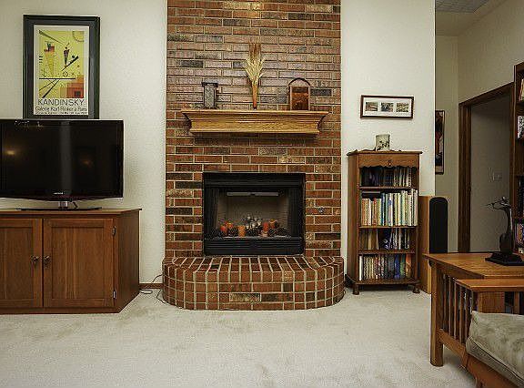 Striking brick fireplace and hearth