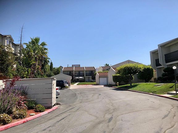 View of Norita Court parking area and of 2740 Norita Court townhouse.
