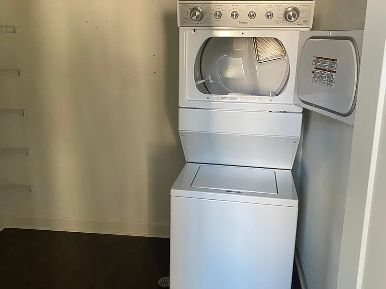 Laundry room with plenty of space and racks for storage or pantry