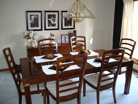 Formal dining room has views to private wooded area.