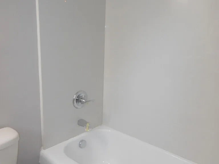 Completely remodeled bathrooms with quartz tub surrounds.