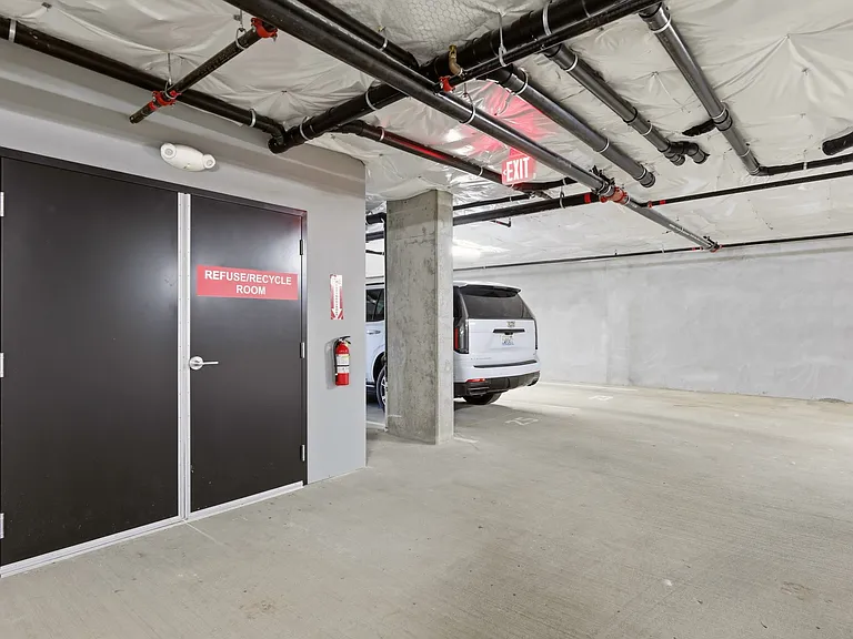Refuse and Recycling Room - Garbage is included. Garbage Shoot on Floor One