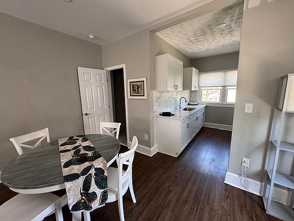 Bathroom and bedroom are off the open dining area.
