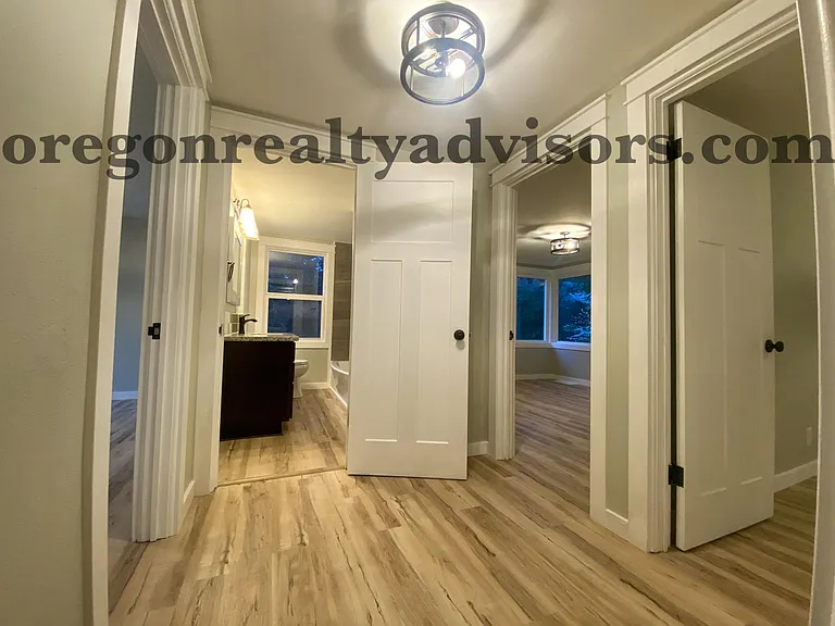 Hallway from living room into 3 Bedrooms and 1 Bathroom