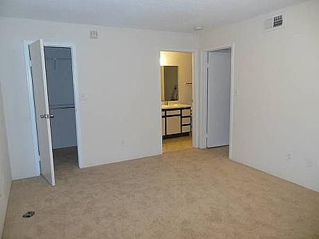 Bdrm showing walk-in closet